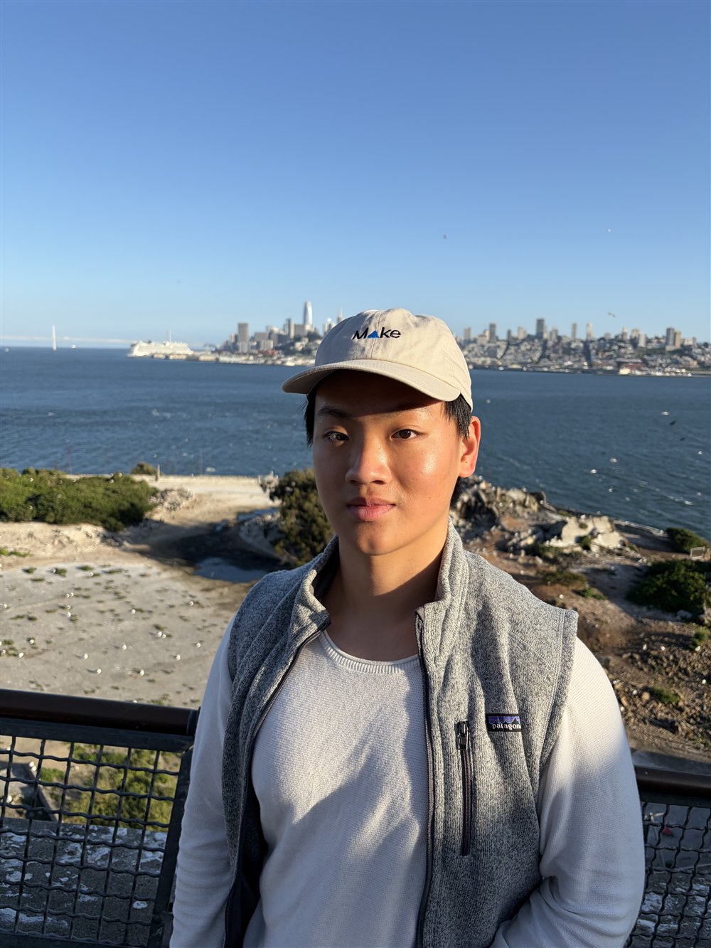 Manh with the San Francisco skyline across the bay